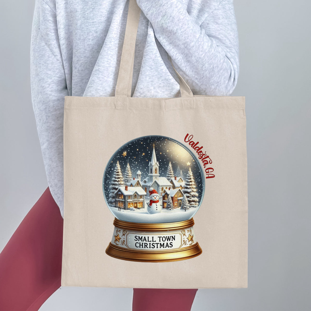 Tote bag with a snow globe featuring Valdosta, GA and "Small Town Christmas."
