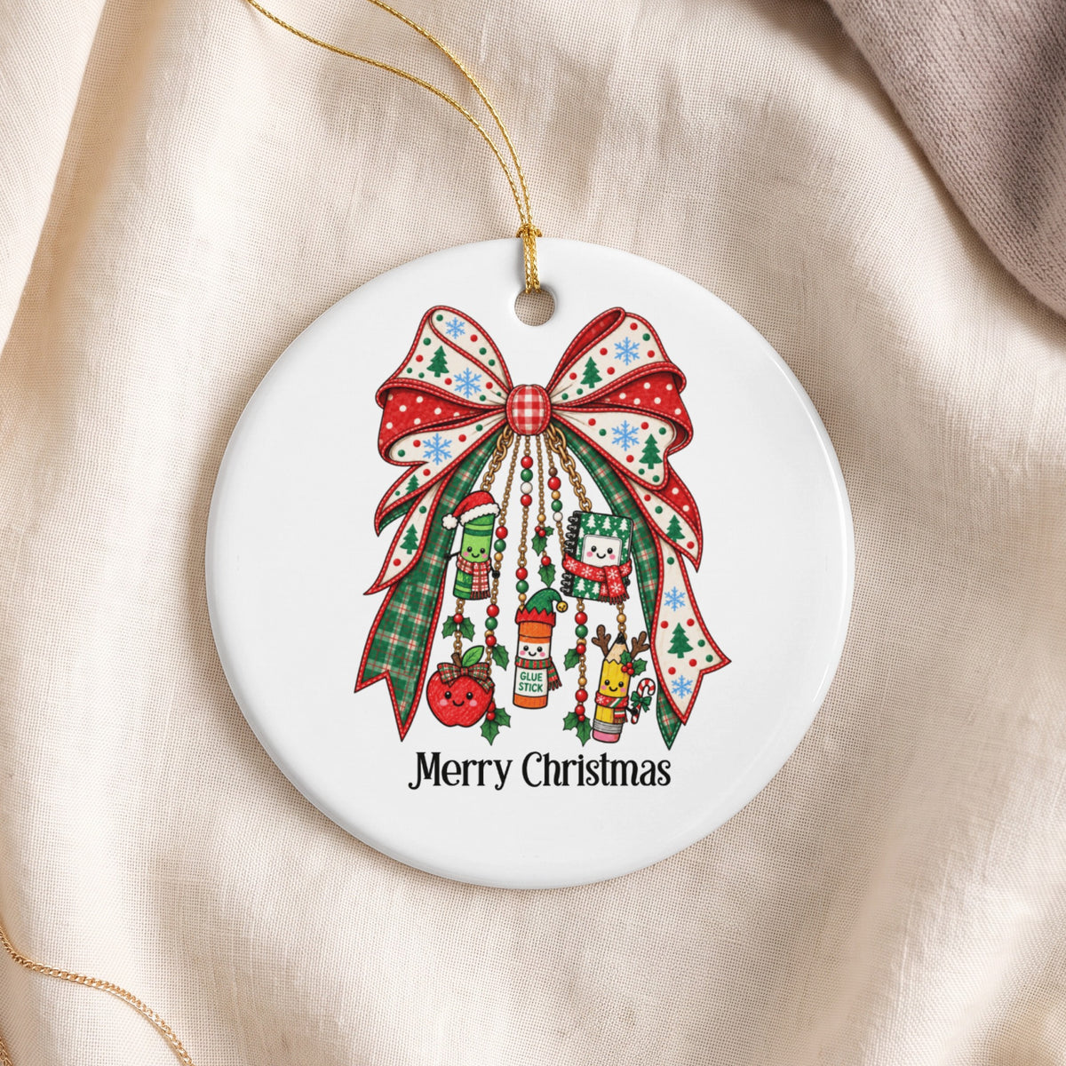 Round ornament with Christmas bow, school supplies, and "Merry Christmas" text.