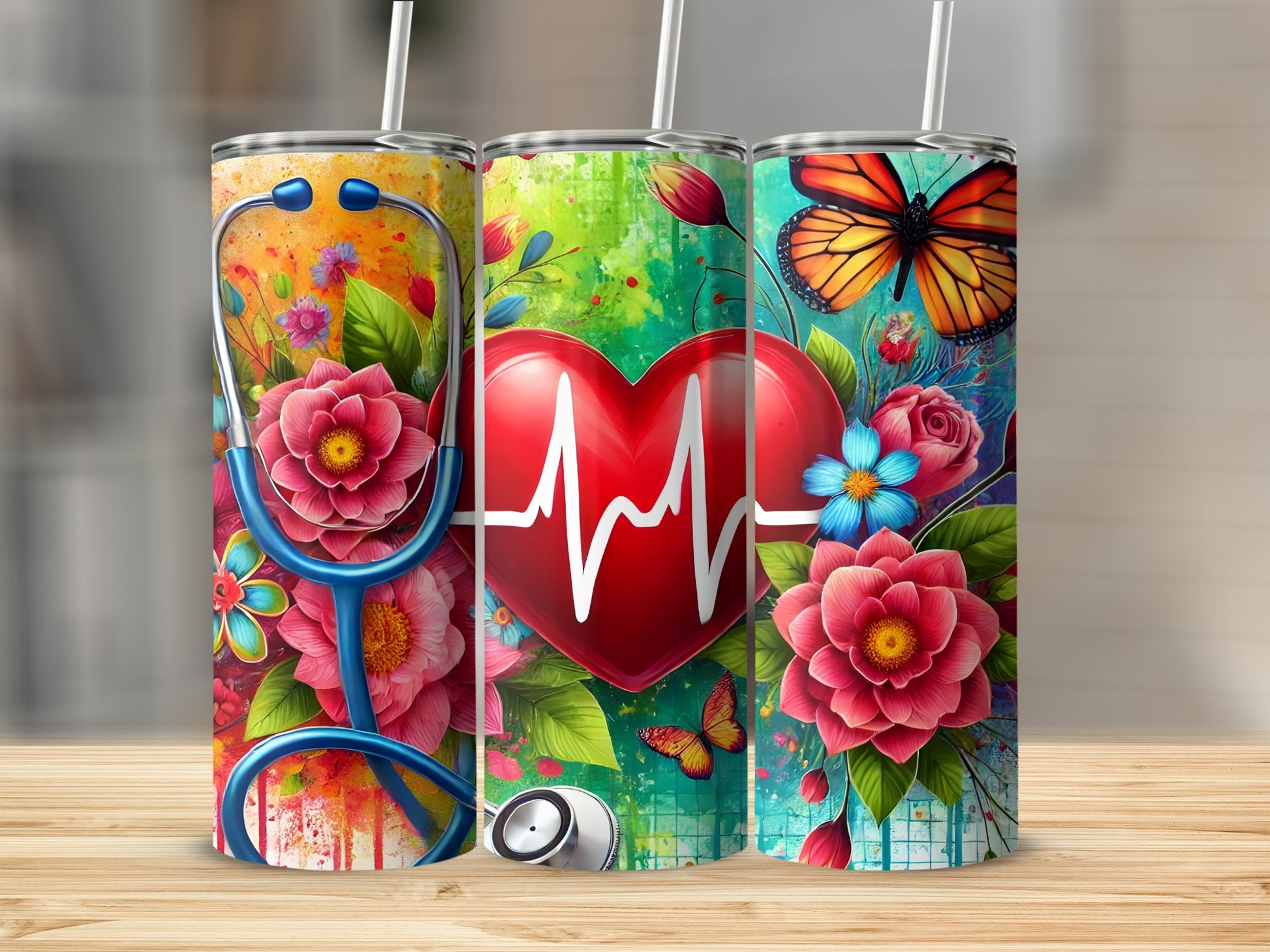 Three tumblers with colorful floral designs and medical heart graphics.