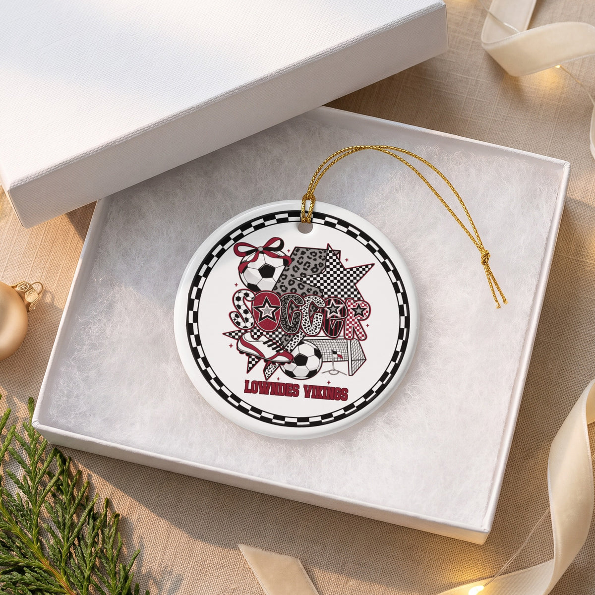 Round Lowndes Vikings soccer ornament with scrapbook-style graphics in an open box.