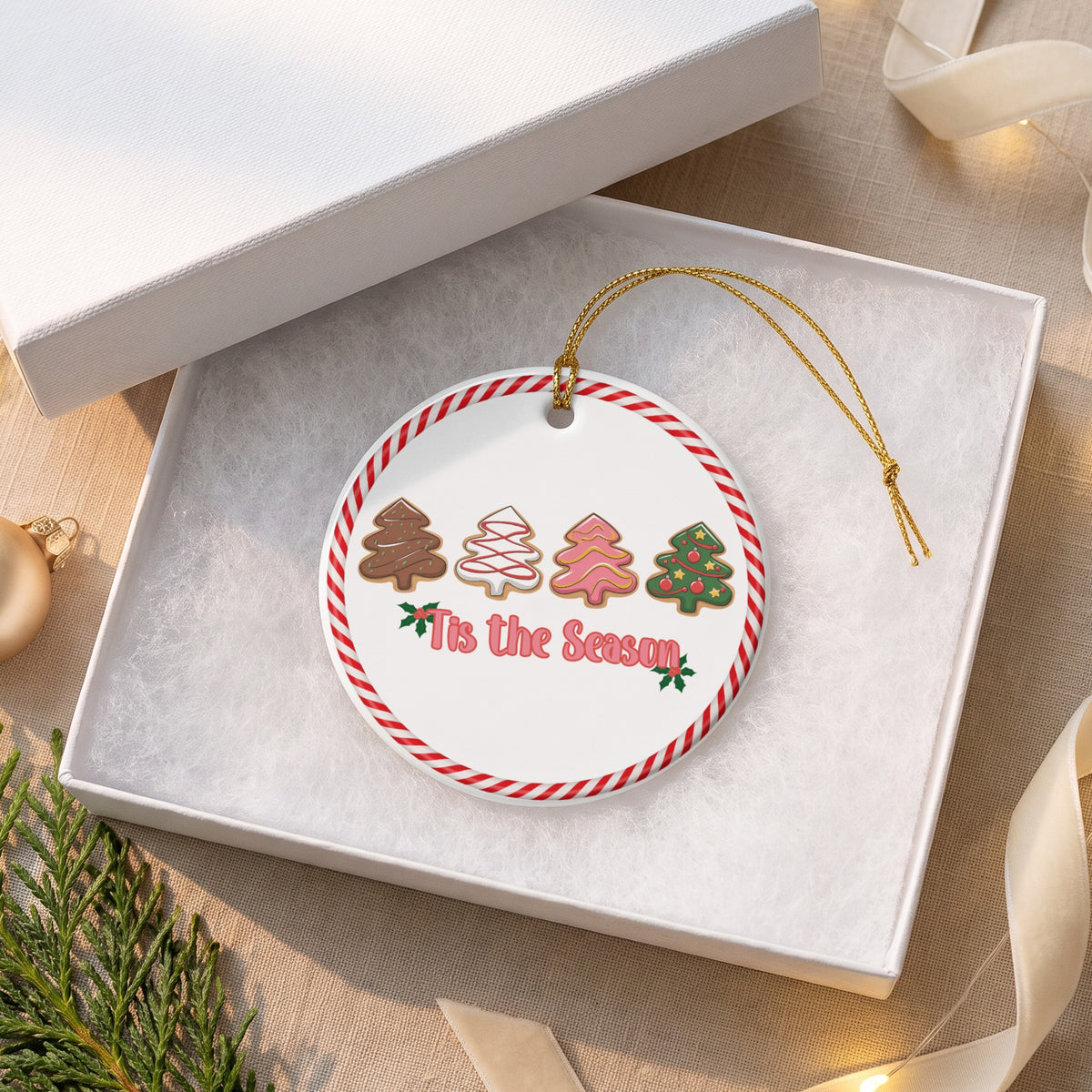 Round ornament with gingerbread trees and "Tis the Season" text in a gift box.