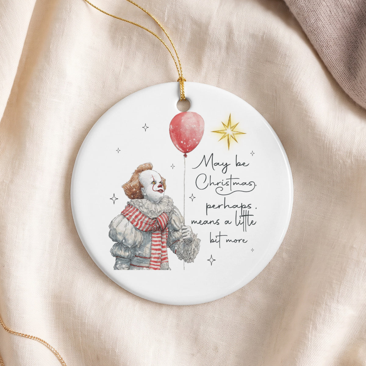 Round ceramic ornament with clown holding red balloon and text "May be Christmas, perhaps, means a little bit more".