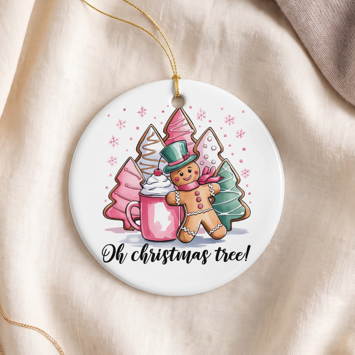 Round ornament with gingerbread man, hot chocolate, and Christmas tree cookies.