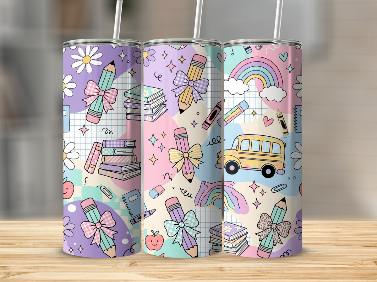 Three tall tumblers with straws feature a pastel school-themed pattern showing pencils, books, and buses.