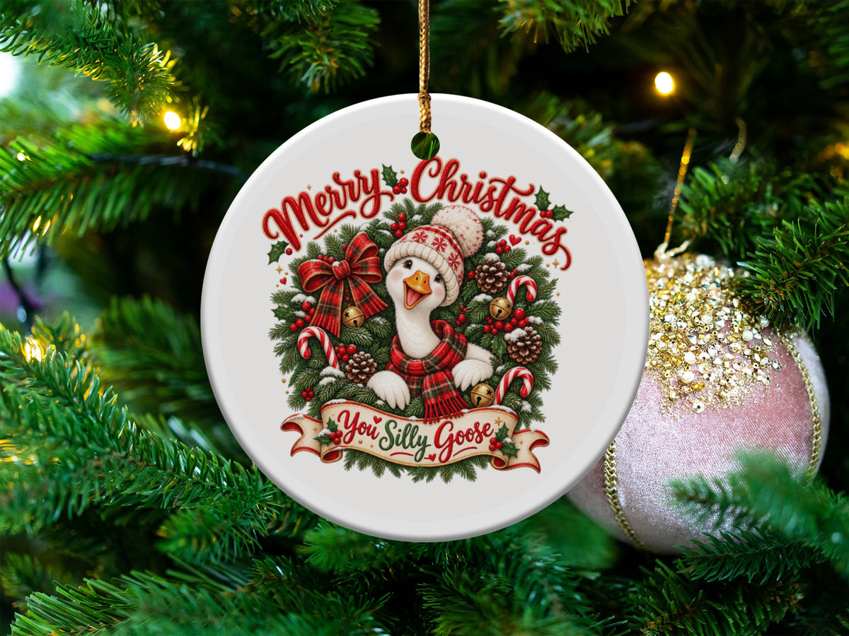 Christmas ornament with a goose wearing a Santa hat and scarf, with text "You Silly Goose".