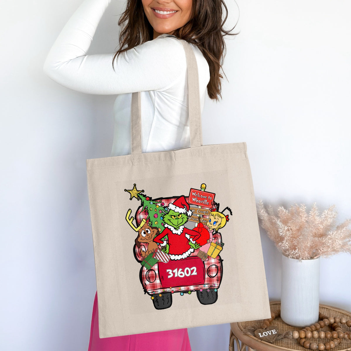 Tote bag with Grinch, Cindy Lou Who, Max, and Christmas tree in plaid truck.