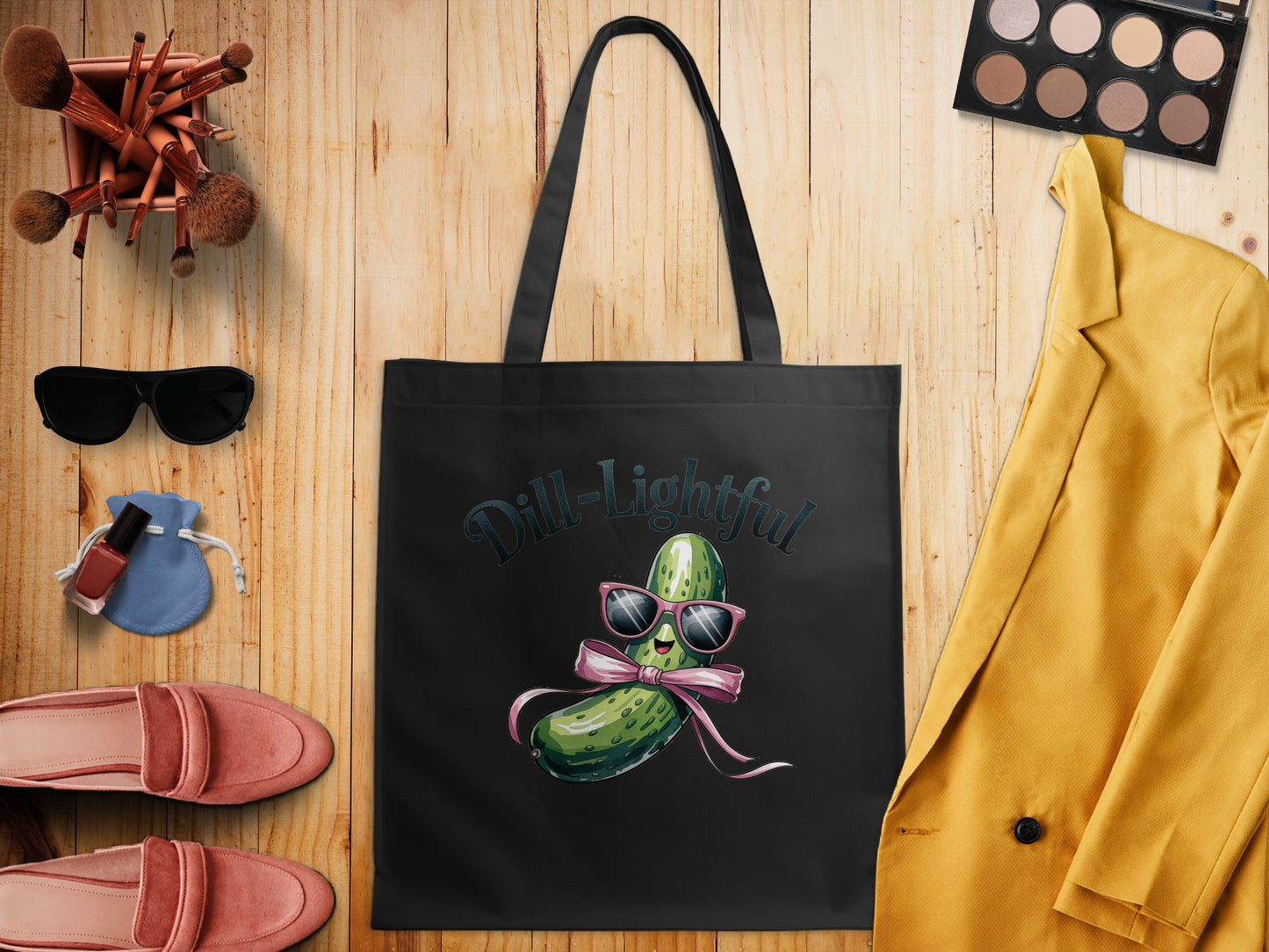 Black tote bag with smiling pickle wearing sunglasses and bow, "Dill-Lightful" text.