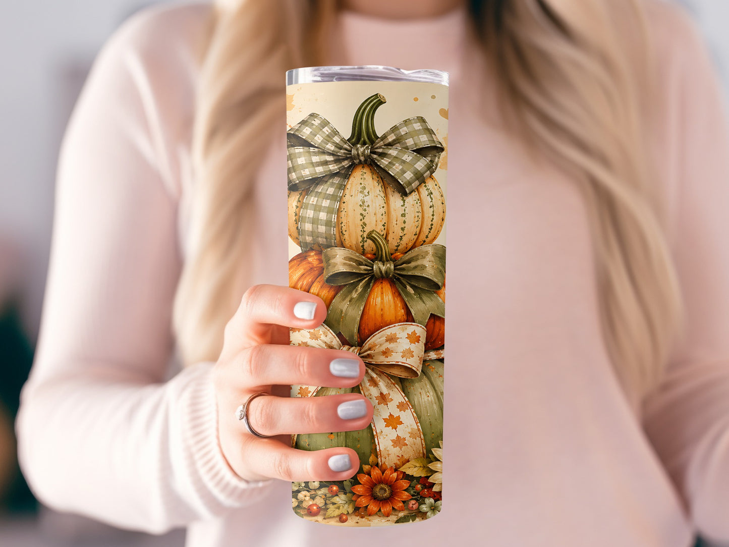 Tumbler featuring stacked pumpkins with decorative bows and autumn leaves.