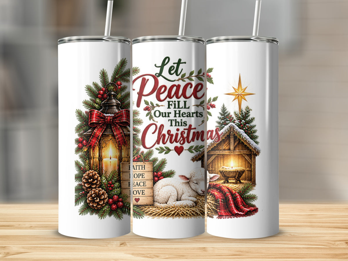 Three white cylindrical tumblers featuring a Christmas nativity scene with text reading Let Peace Fill Our Hearts This Christmas.
