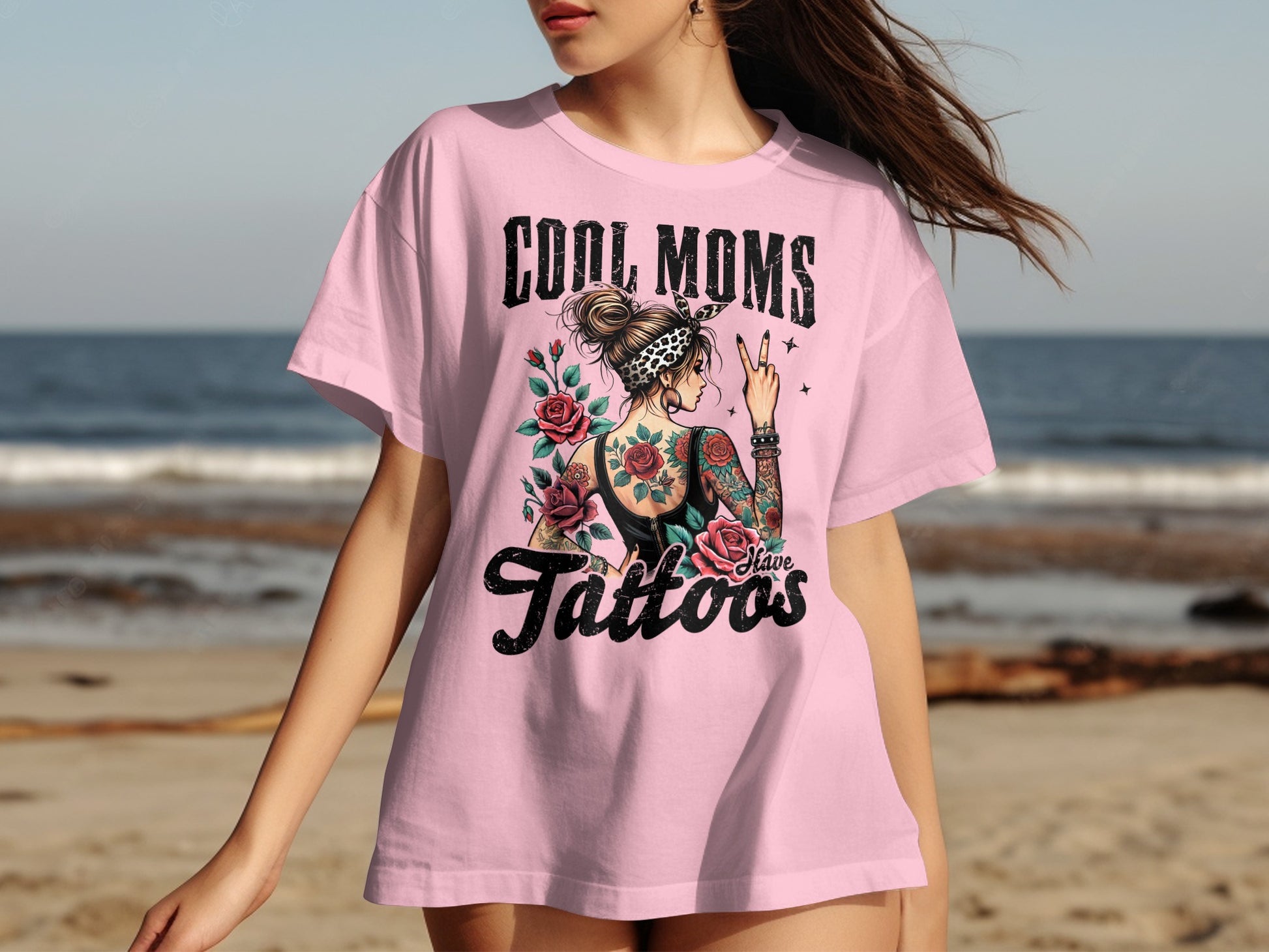 Pink t-shirt with "Cool Moms Have Tattoos" text and rose design.