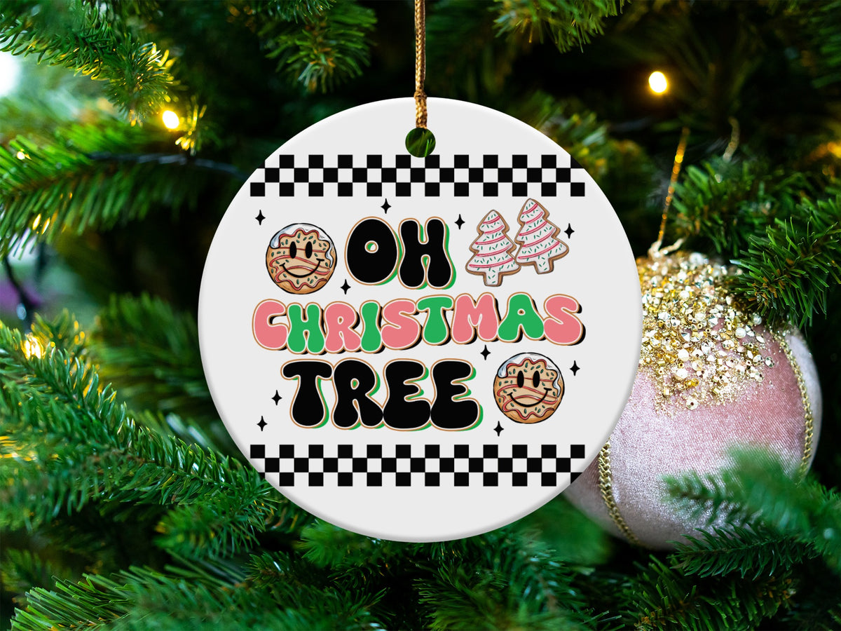 Round ceramic ornament with "Oh Christmas Tree" text and festive cookies.