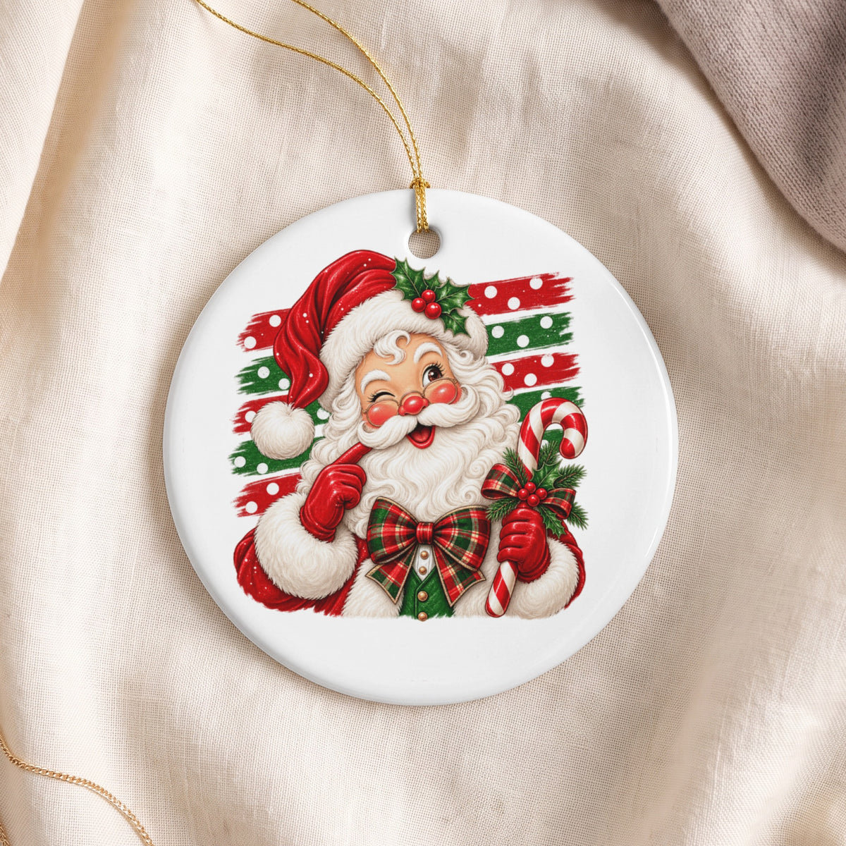 Round ornament featuring a winking Santa Claus holding a candy cane, with a festive background.
