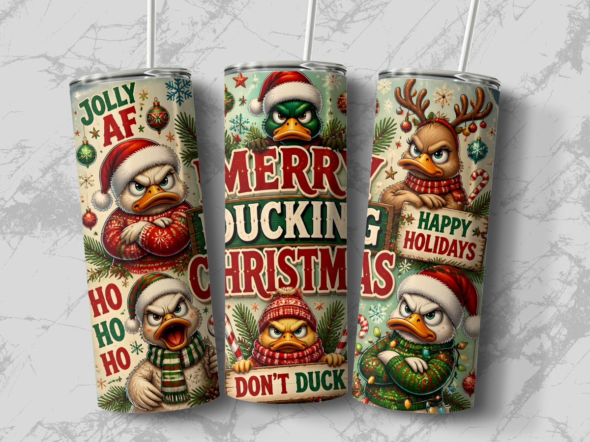 Three insulated tumblers display humorous Christmas designs featuring grumpy cartoon ducks and holiday text.
