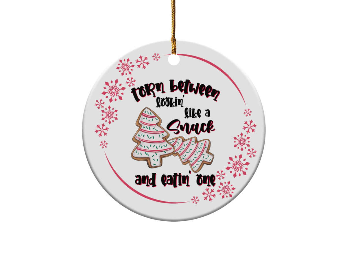 Ornament with text "Torn Between Lookin' Like a Snack and Eatin' One" and tree cookies.