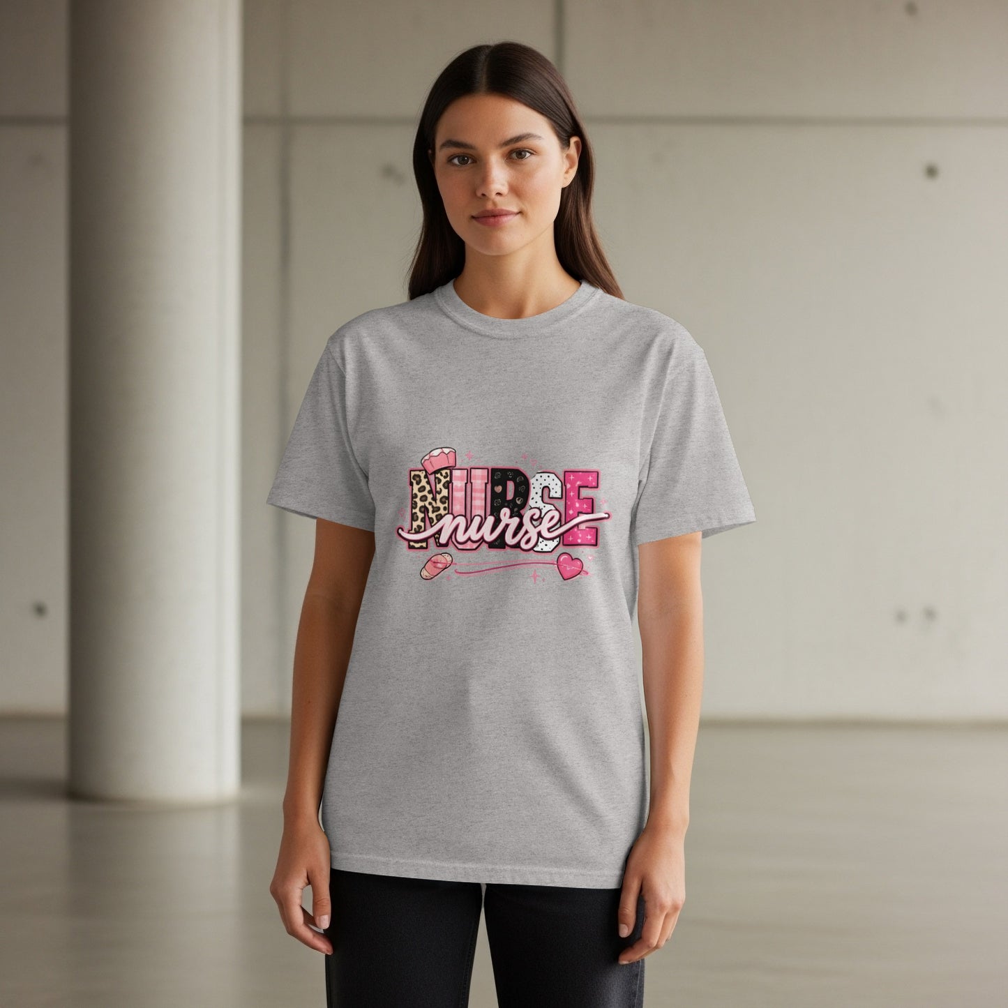 Grey t-shirt with "NURSE" text featuring leopard print and pink heart accents.