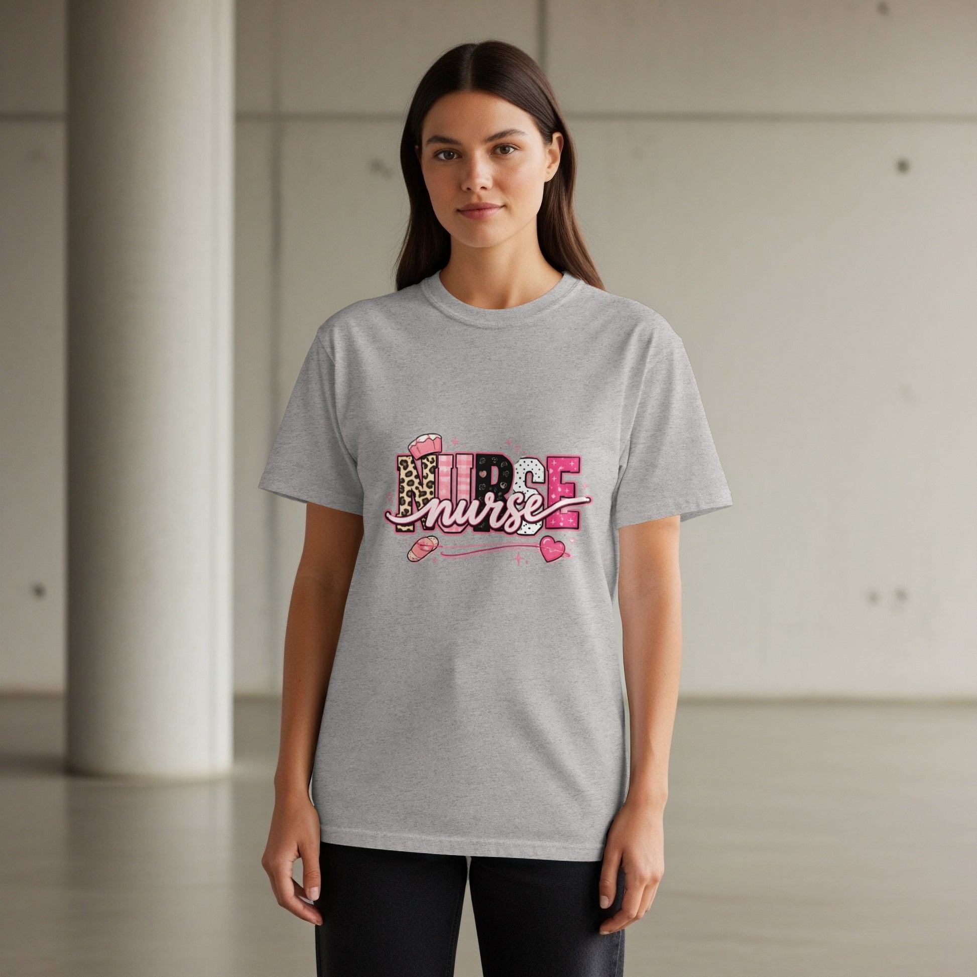 Grey t-shirt with "NURSE" text featuring leopard print and pink heart accents.