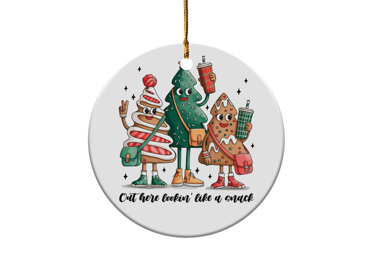 Three Christmas trees are dressed as gingerbread men and holding drinks, with text that reads "Out here lookin' like a snack".