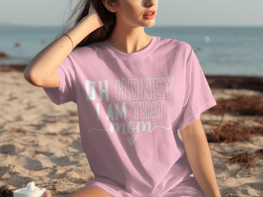 Light pink t-shirt with "Oh Honey I Am That Mom" text.