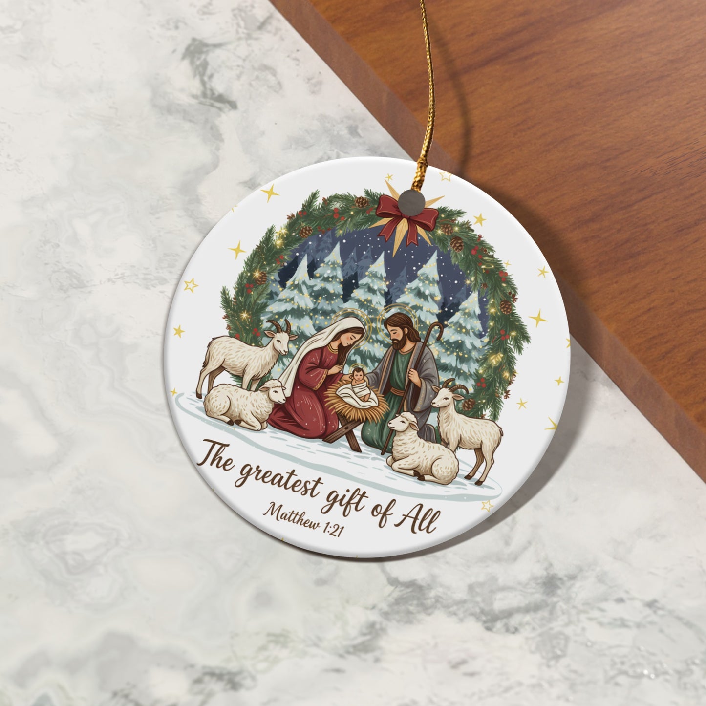 Nativity scene on round ornament with sheep, goats, and text "The greatest gift of All Matthew 1:21."