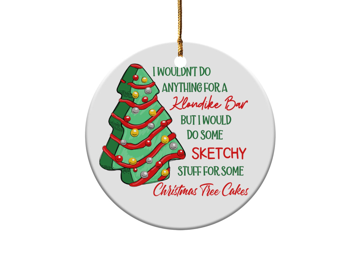 Round ornament with Christmas tree and text: "I wouldn't do anything for a Klondike Bar but I would do some sketchy stuff for some Christmas Tree Cakes."