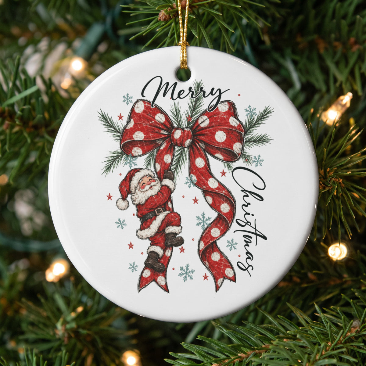 Round ornament with Santa climbing a red and white polka dot ribbon, text "Merry Christmas".