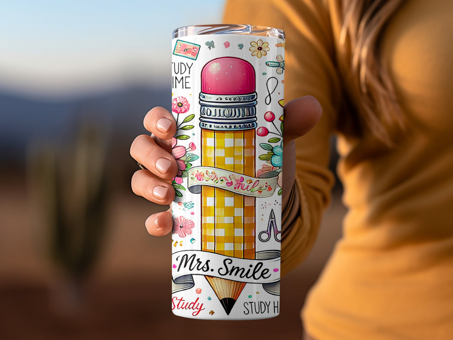 Tumbler with pencil, flowers, scissors, and "Mrs. Smile" text.