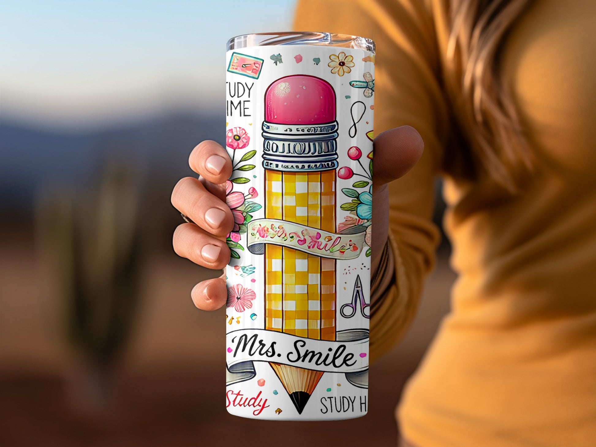Tumbler with pencil, flowers, scissors, and "Mrs. Smile" text.