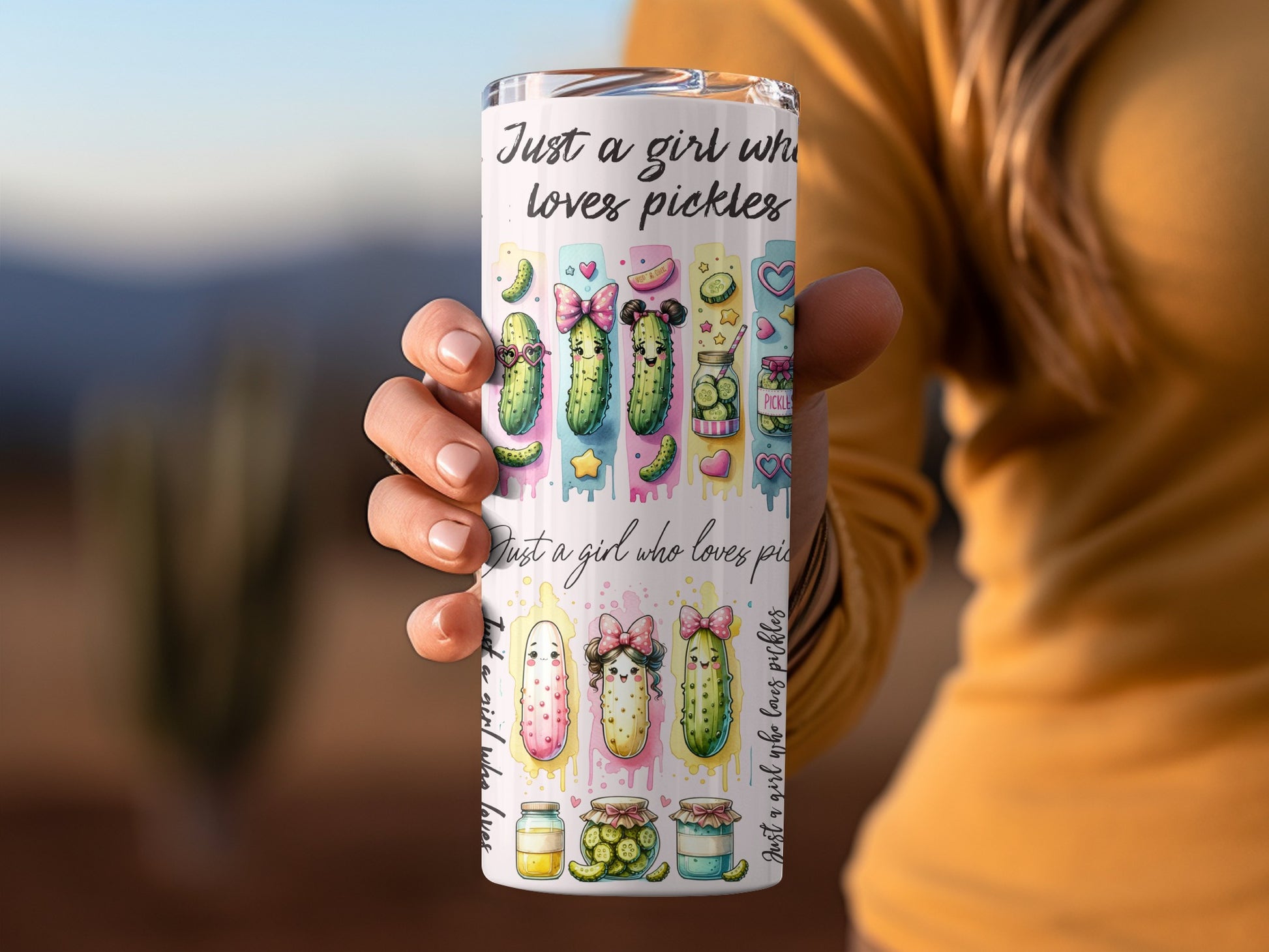 Tumbler with cartoon pickles and text "Just a girl who loves pickles".