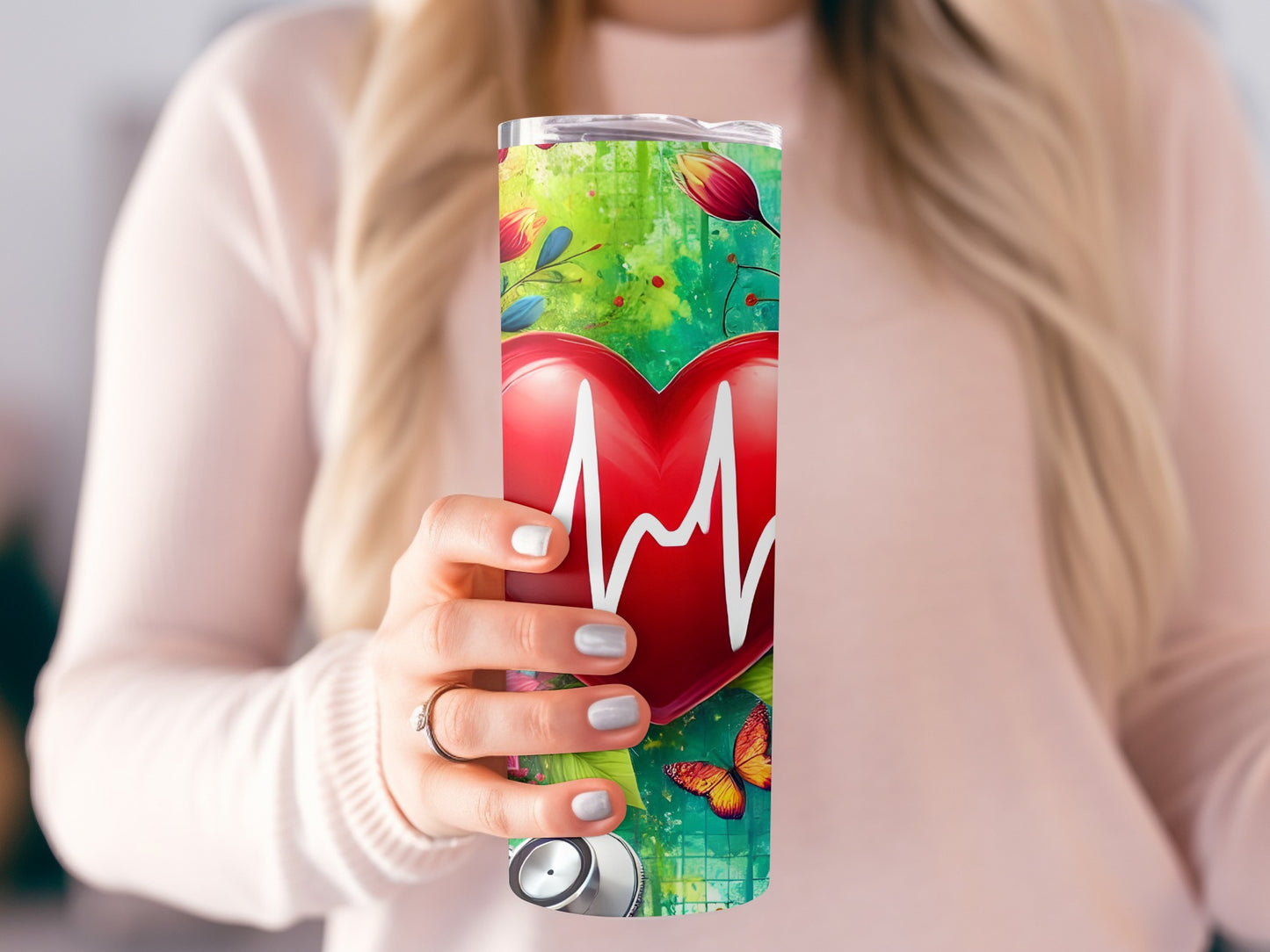 Tumbler with red heart, electrocardiogram, flowers, and butterflies.