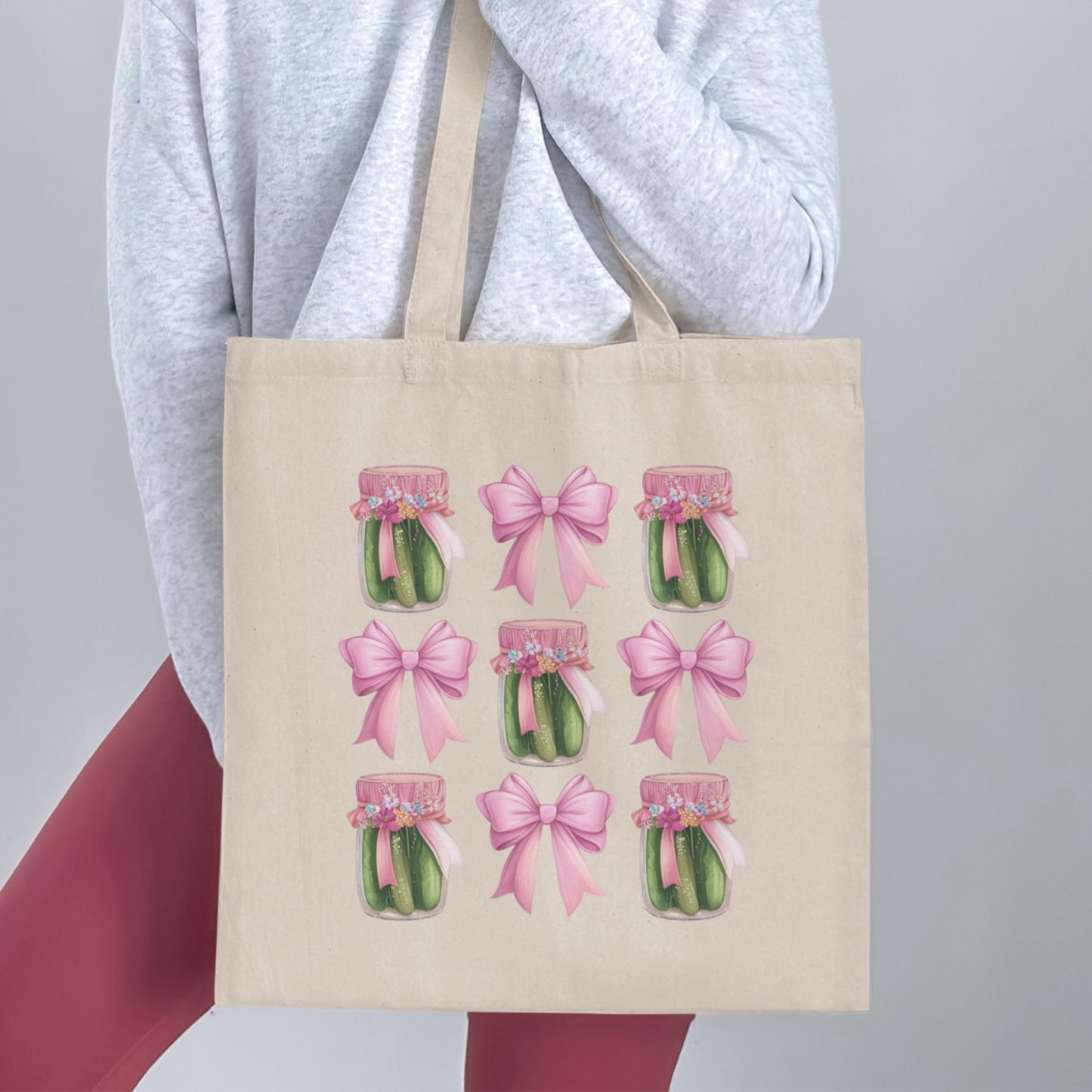 Tote bag with jars of pickles and pink bows pattern.