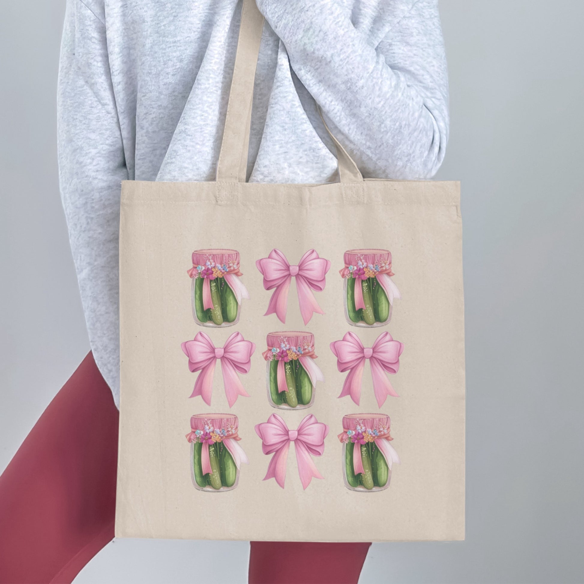 Tote bag with jars of pickles and pink bows pattern.