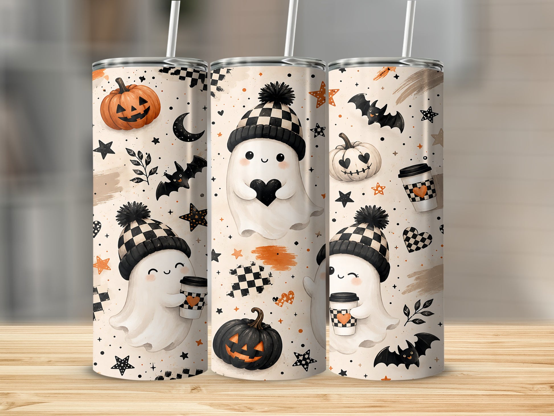 Three tumblers featuring cute ghosts, pumpkins, bats, and checkered patterns.