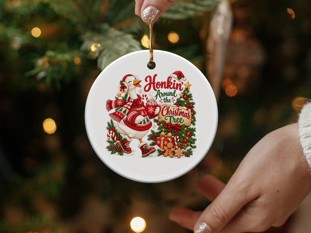 Round ornament with a goose in a scarf and hat, text "Honkin Around the Christmas Tree".