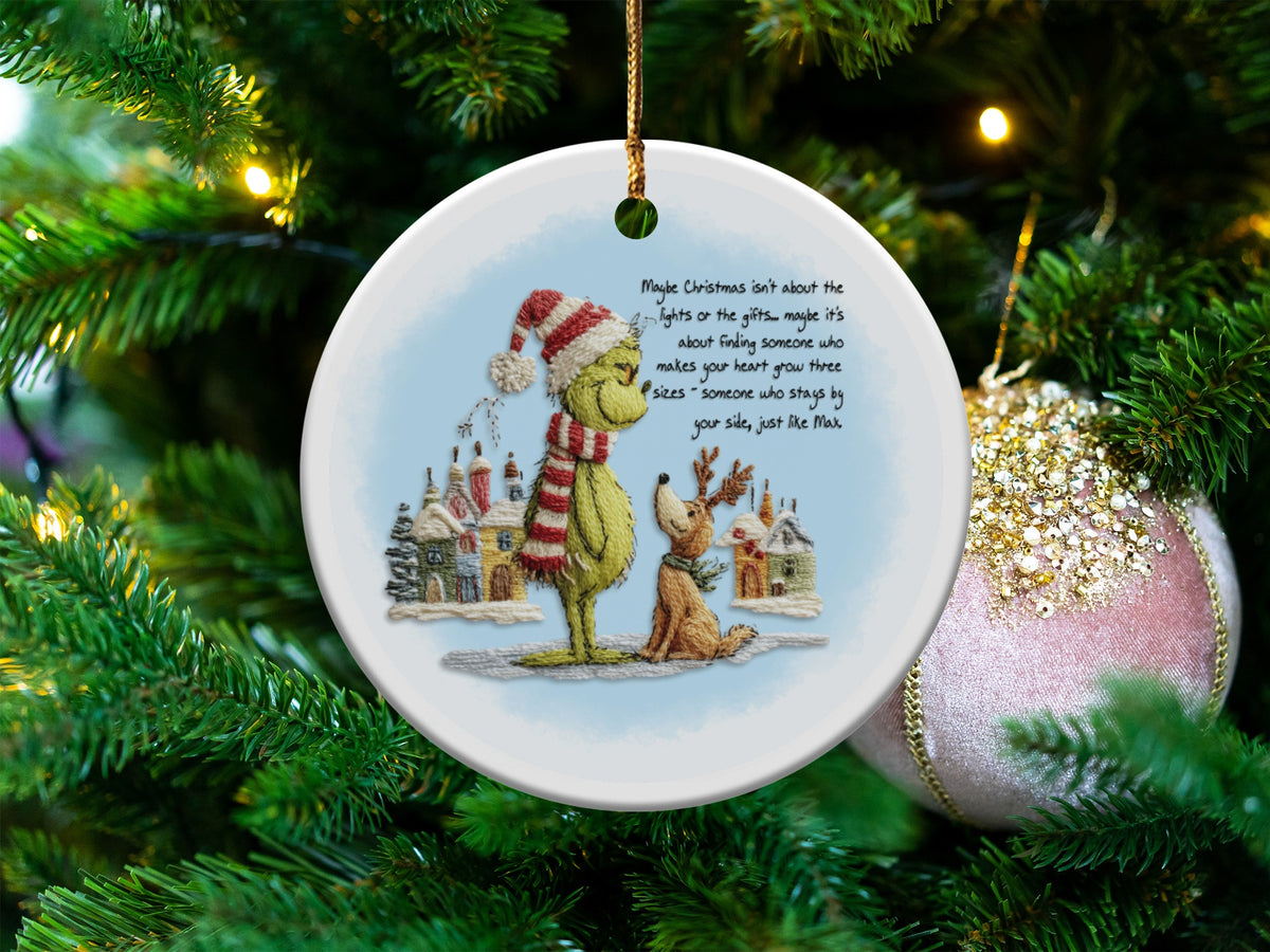 Grinch and Max ornament with Christmas quote, hanging on a tree.