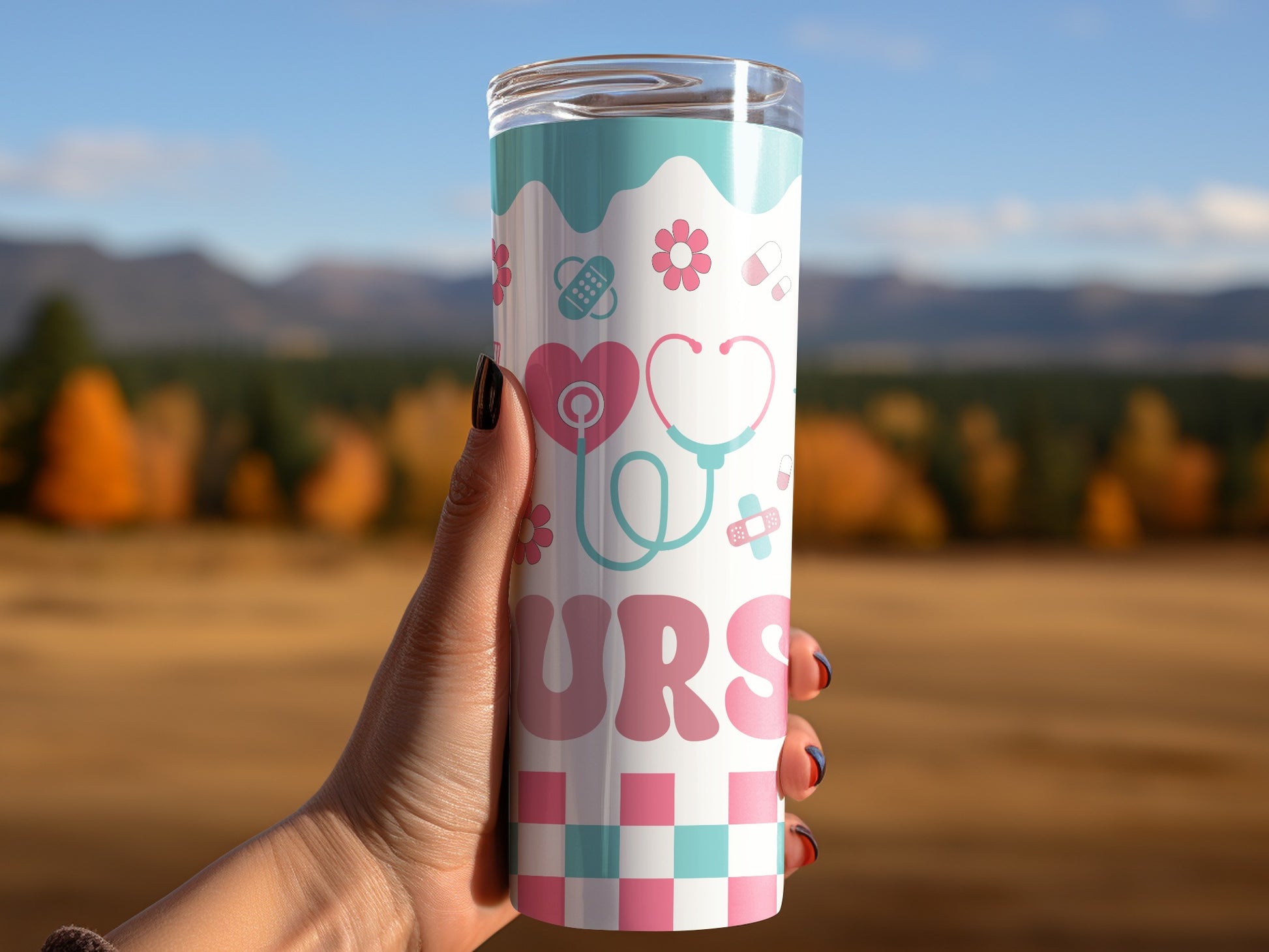 Tumbler with stethoscope, heart, and floral nurse-themed pattern.