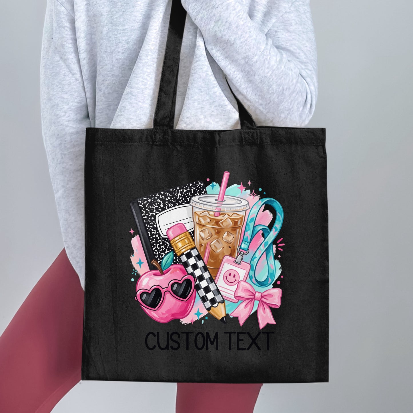 Black tote bag with school icons and "CUSTOM TEXT" design