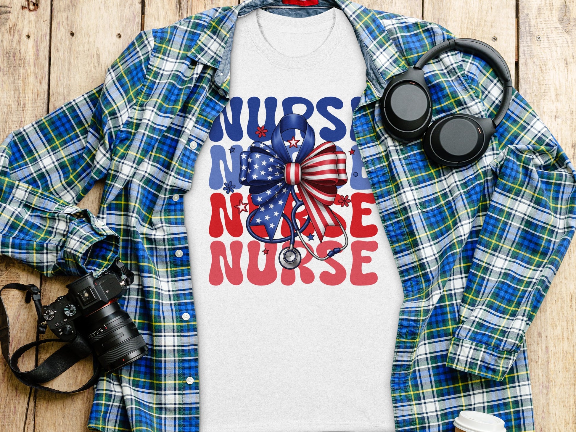 Nurse graphic on t-shirt with patriotic bow, stethoscope, camera, and headphones.