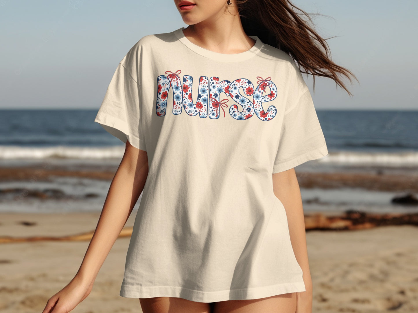 Cream t-shirt with "Nurse" text in patriotic floral pattern.