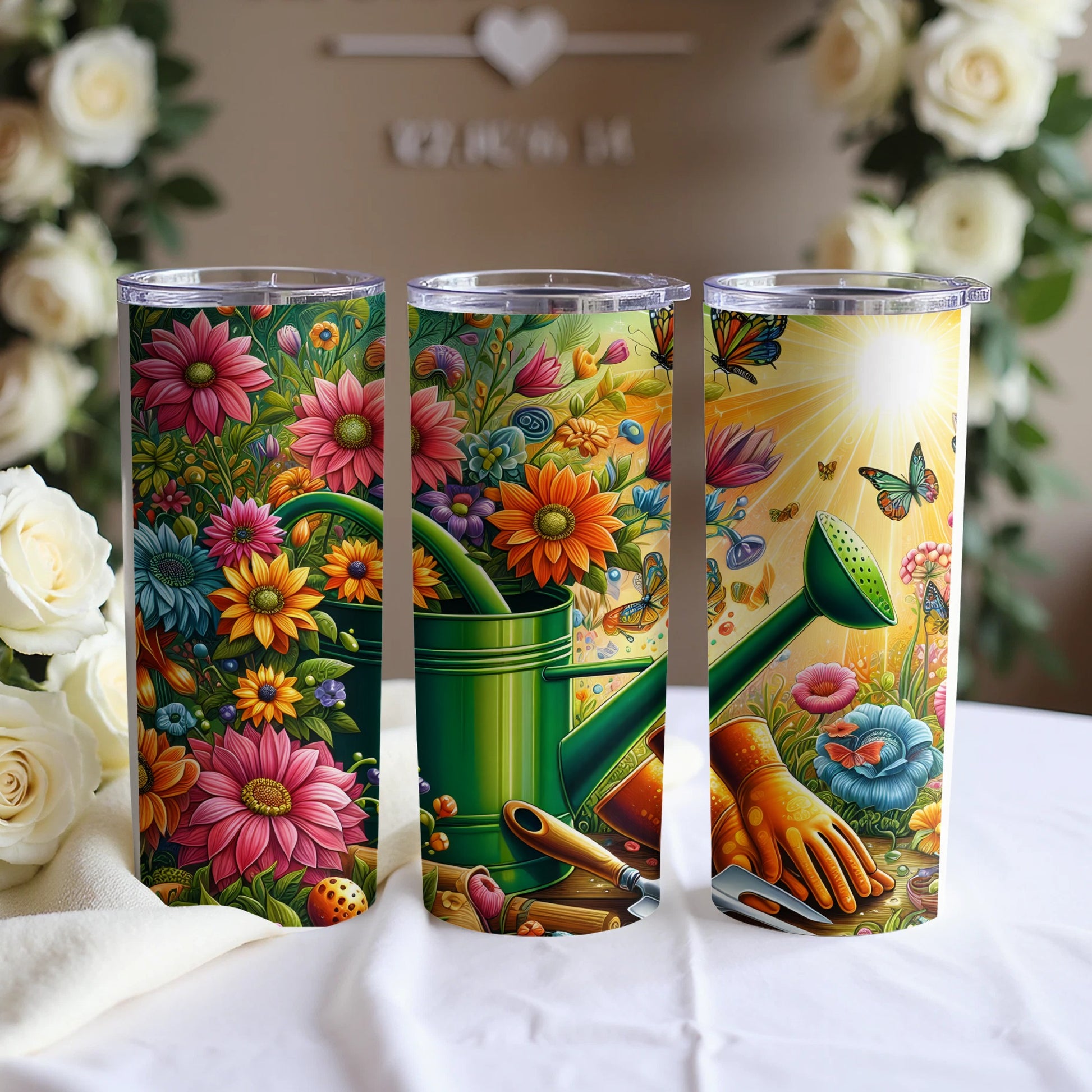 Three floral tumblers with gardening tools and butterflies.