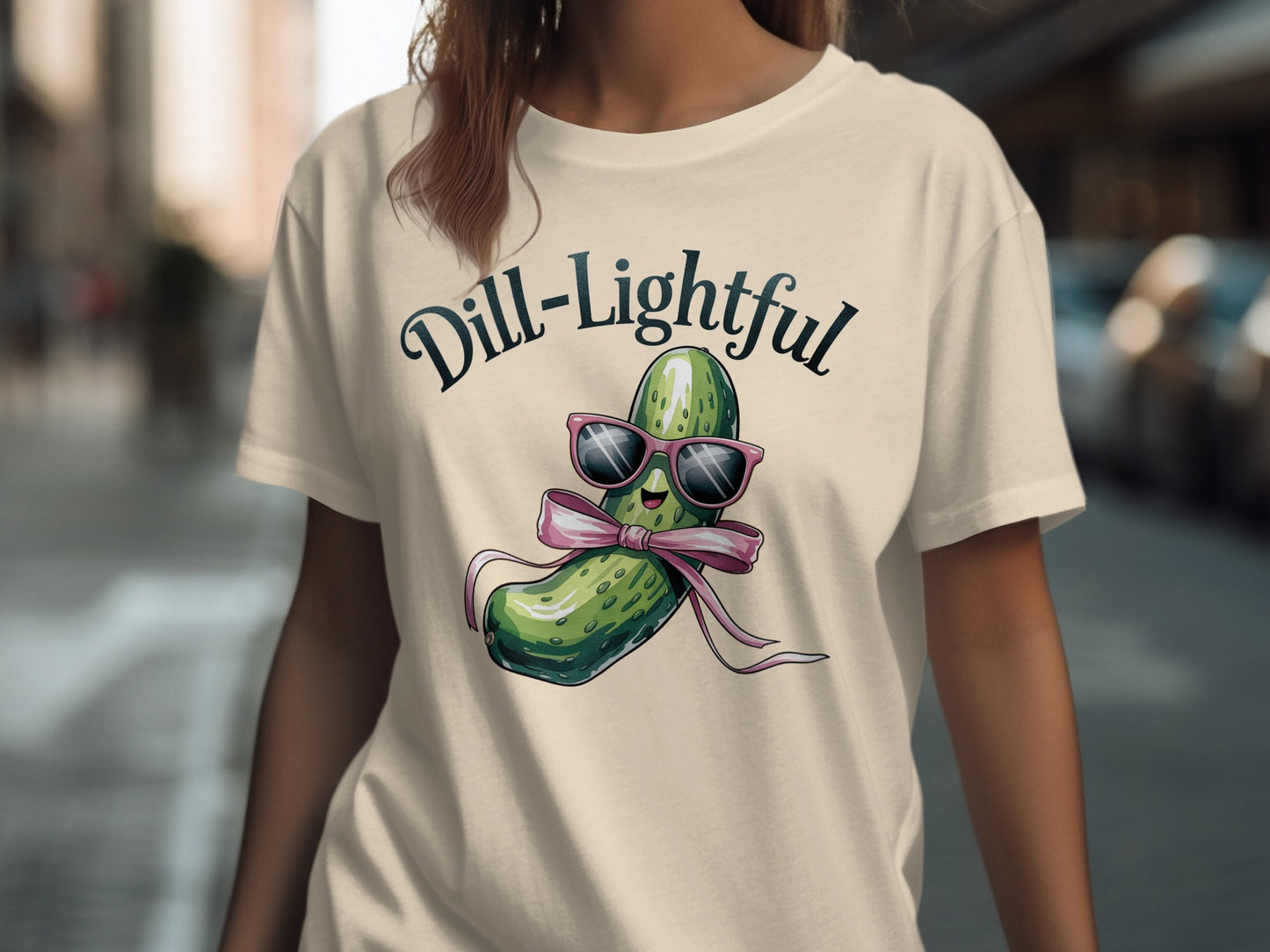 T-shirt with a cartoon pickle wearing sunglasses and a bow tie.