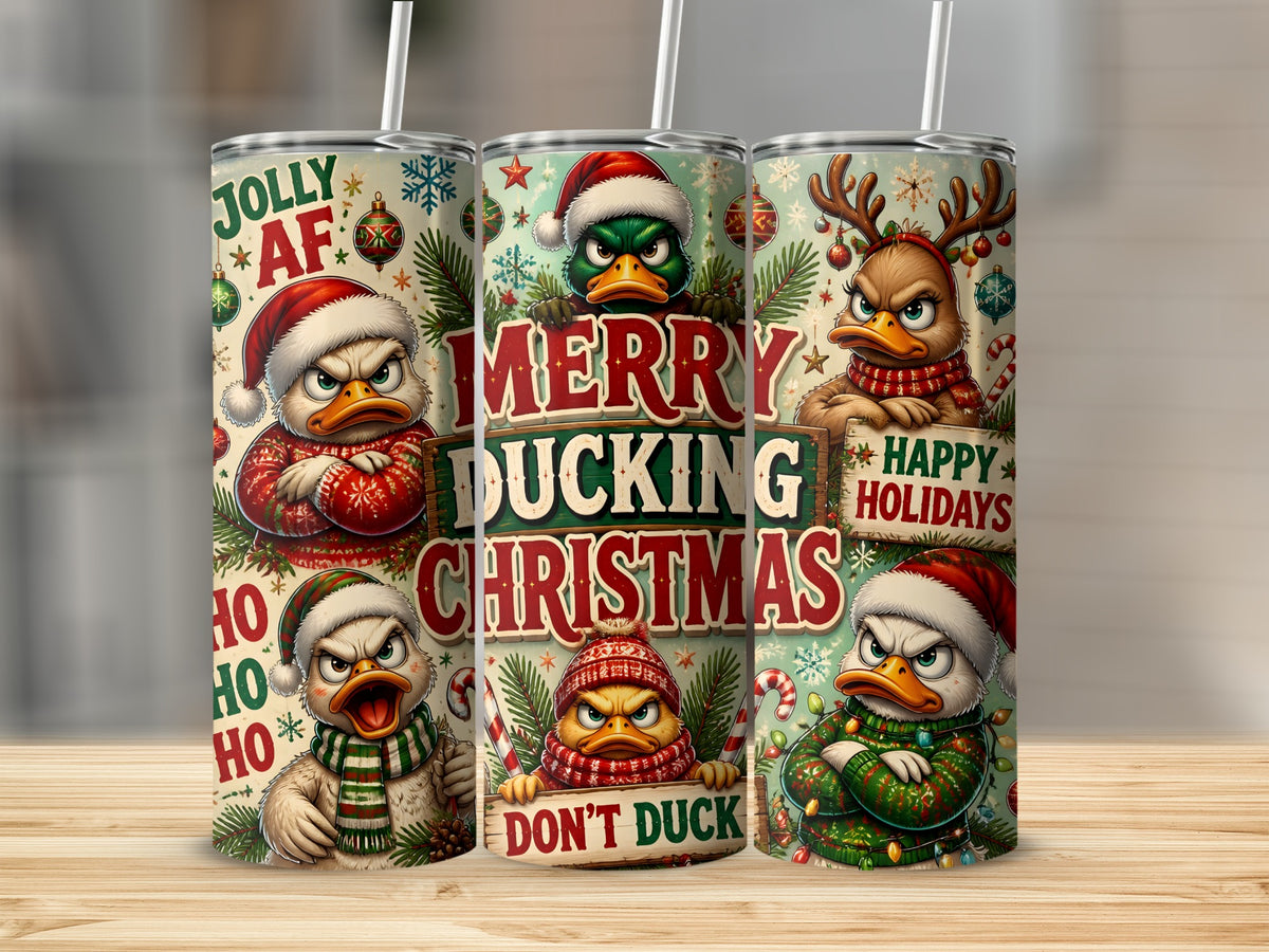 Three metal tumblers with straws feature a Christmas duck pattern with the text Merry Ducking Christmas.