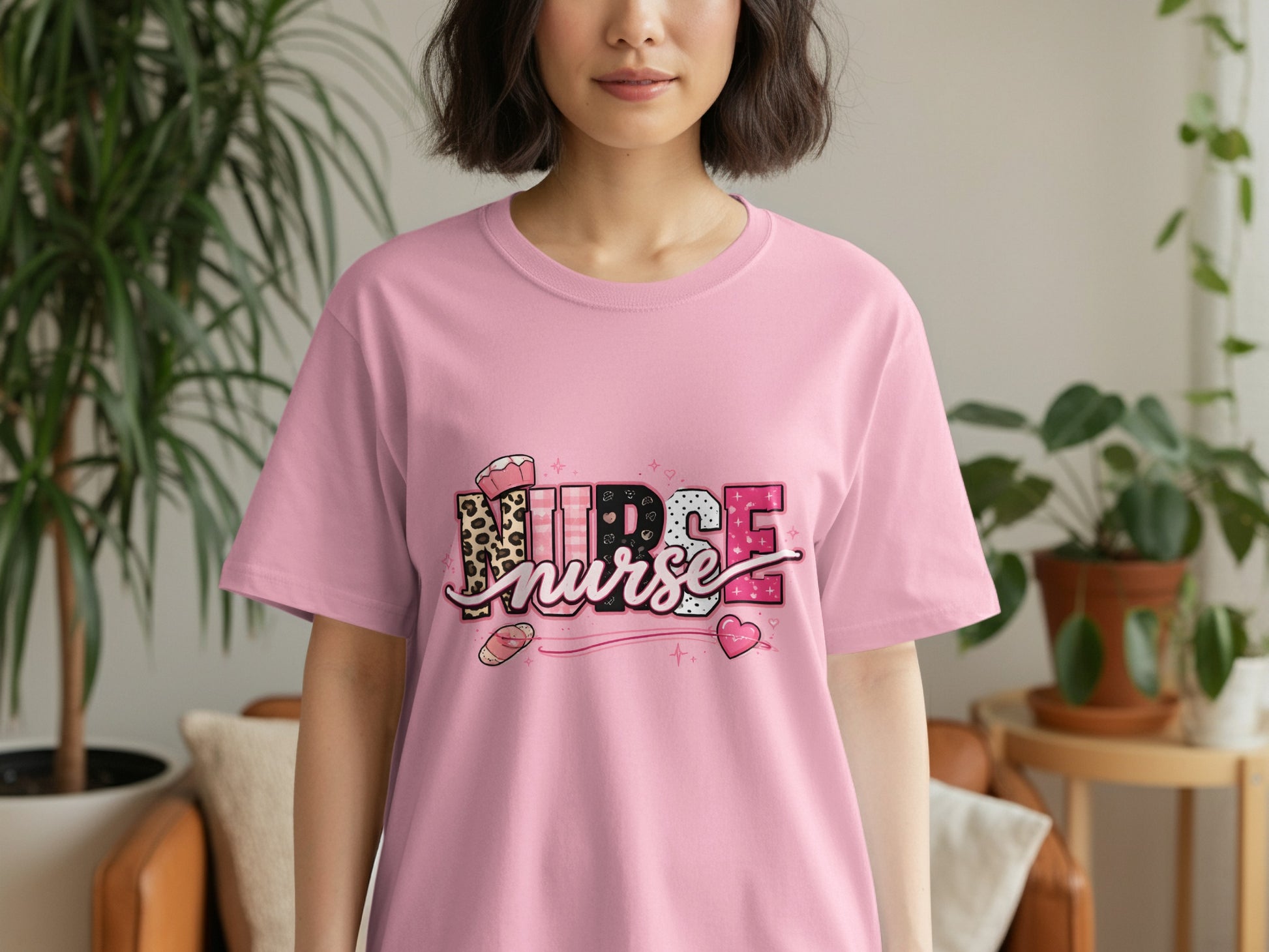 Pink t-shirt with "NURSE" text in a decorative pattern.