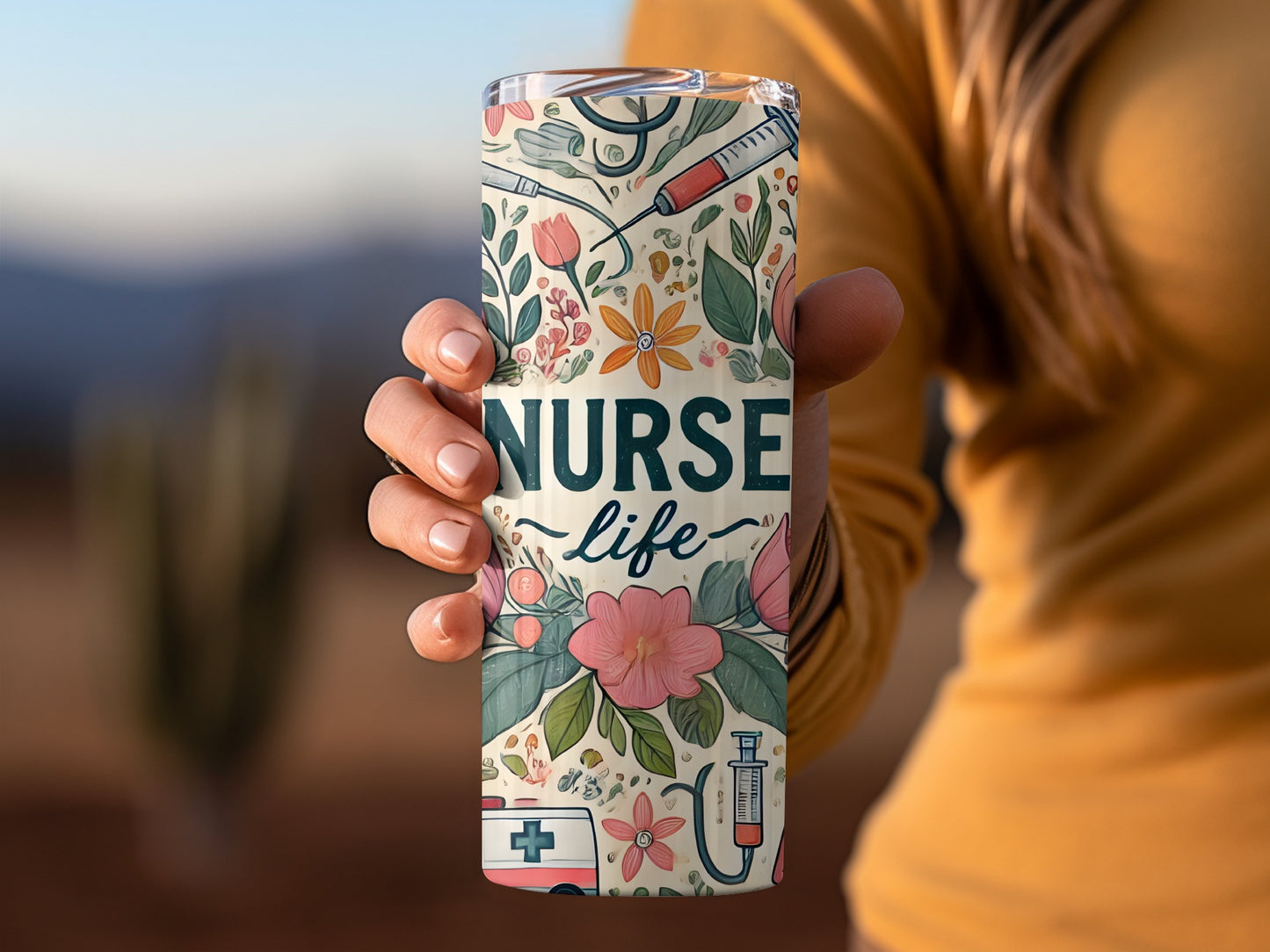 Tumbler with "Nurse Life" text and medical and floral illustrations.
