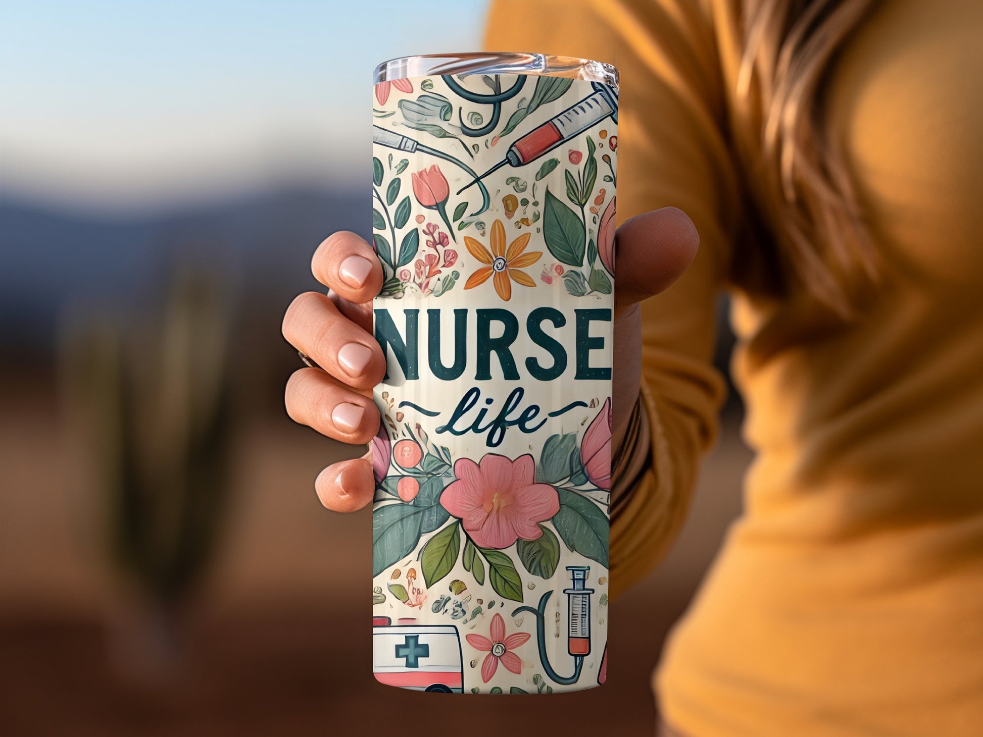 Tumbler with "Nurse Life" text and medical and floral illustrations.