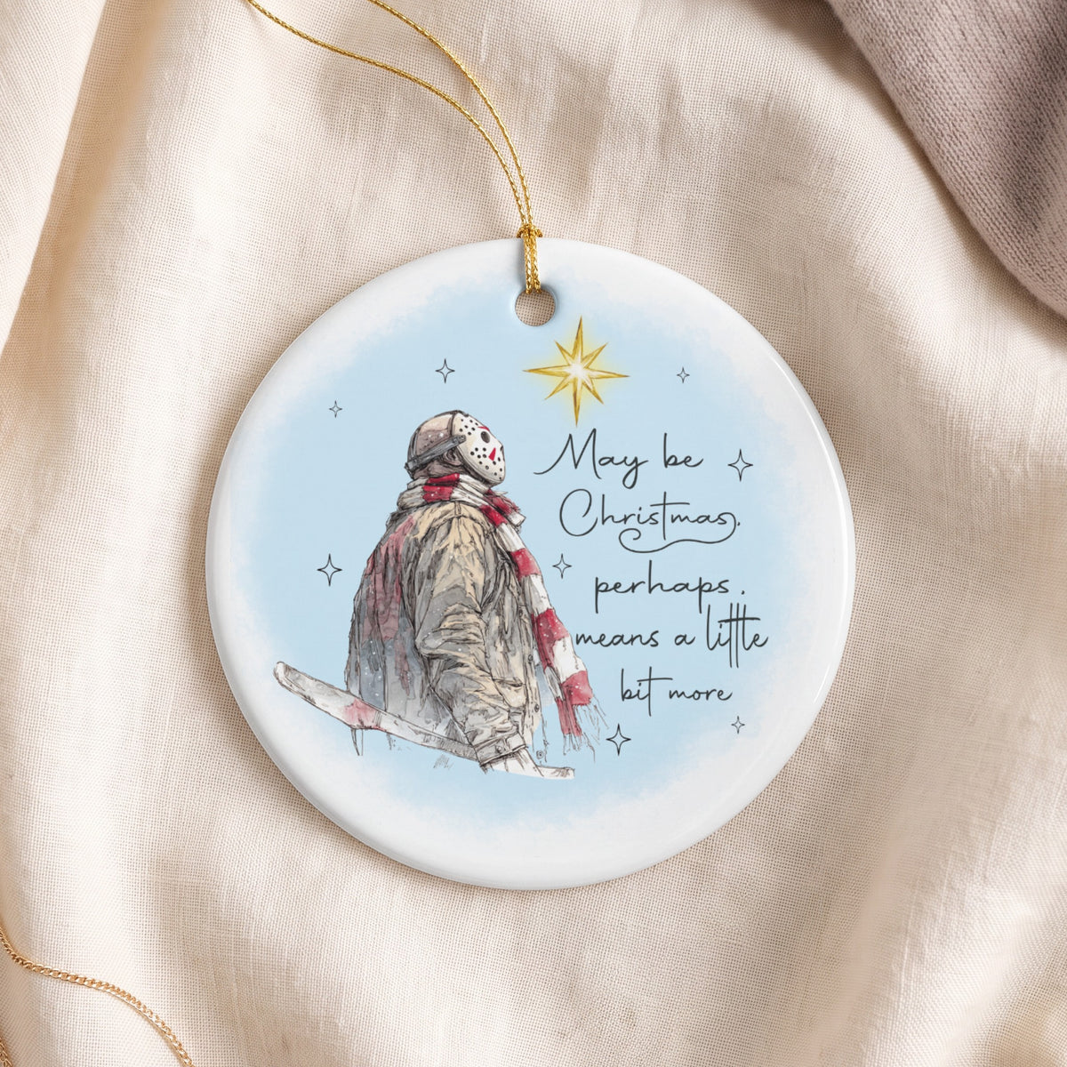 Round ornament featuring Jason Voorhees with text "May be Christmas, perhaps, means a little bit more."