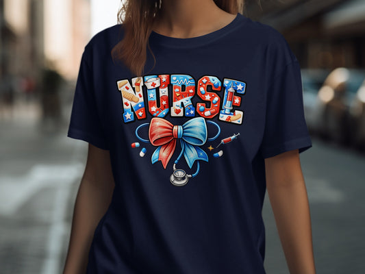 Navy t-shirt with "NURSE" in patriotic letters, stethoscope, and red bows.