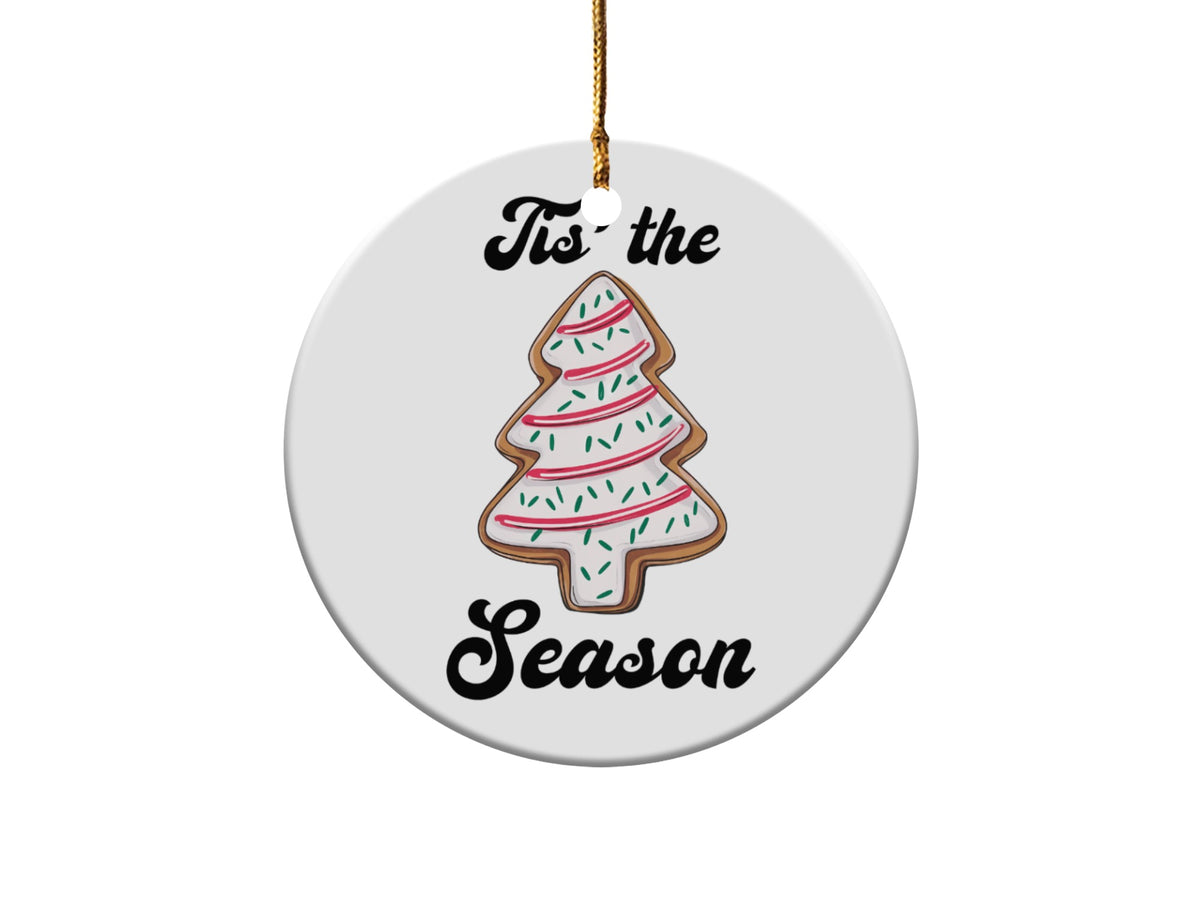 Round ornament with a decorated Christmas tree cookie and text "Tis the Season."
