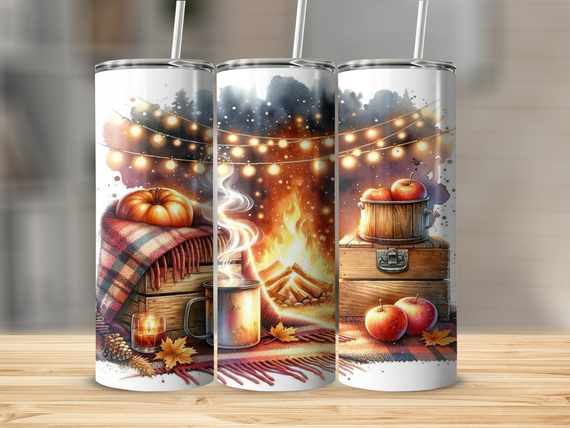 Tumblers with autumn theme: pumpkin, campfire, apples, and string lights.