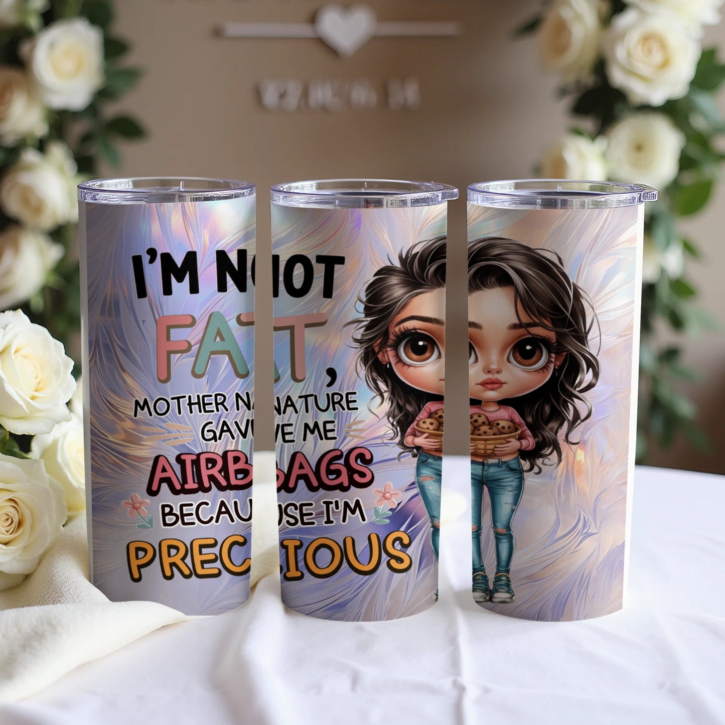 Tumbler with "I'm not fat, mother nature gave me airbags" and cartoon girl.