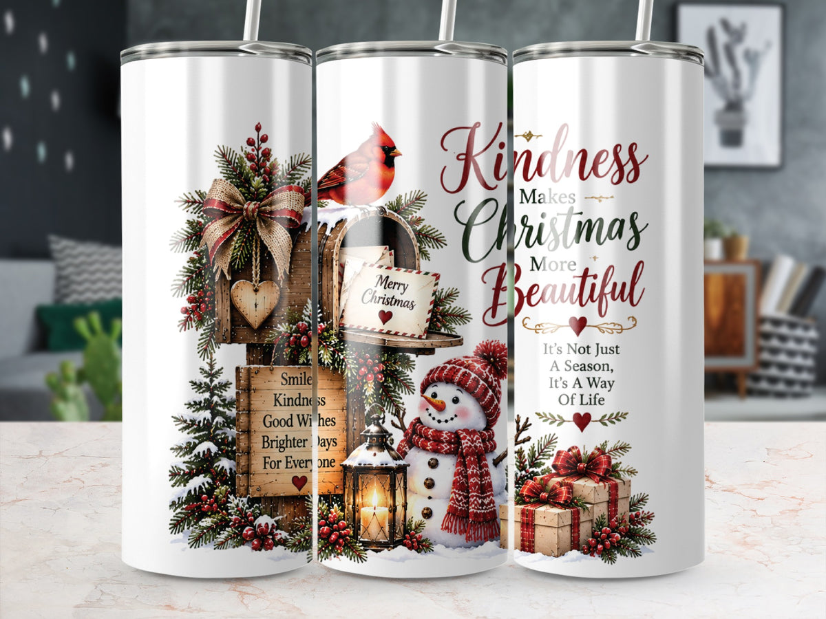 Three white stainless steel tumblers with straws, featuring Christmas graphics including a cardinal, mailbox, snowman, and inspirational text.